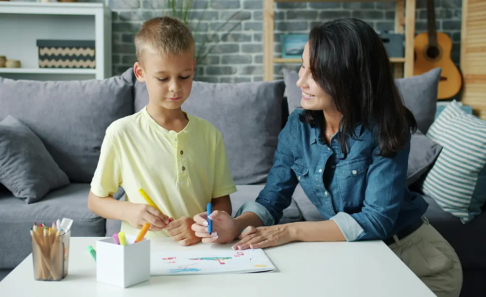 ABA therapist working with child on R&D tax credit eligible healthcare innovations.