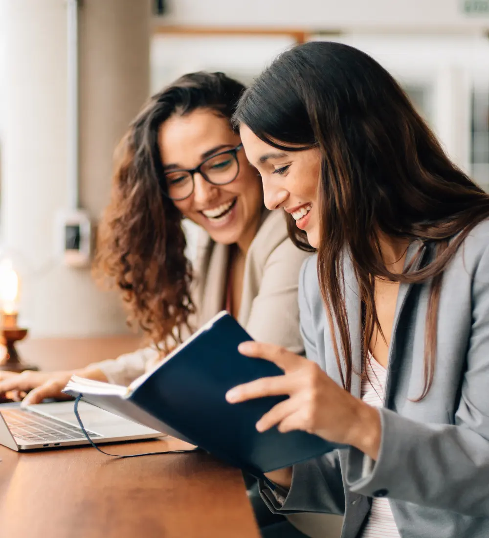 R&D tax credit specialists at ROI Blueprint discussing strategic tax planning for clients.